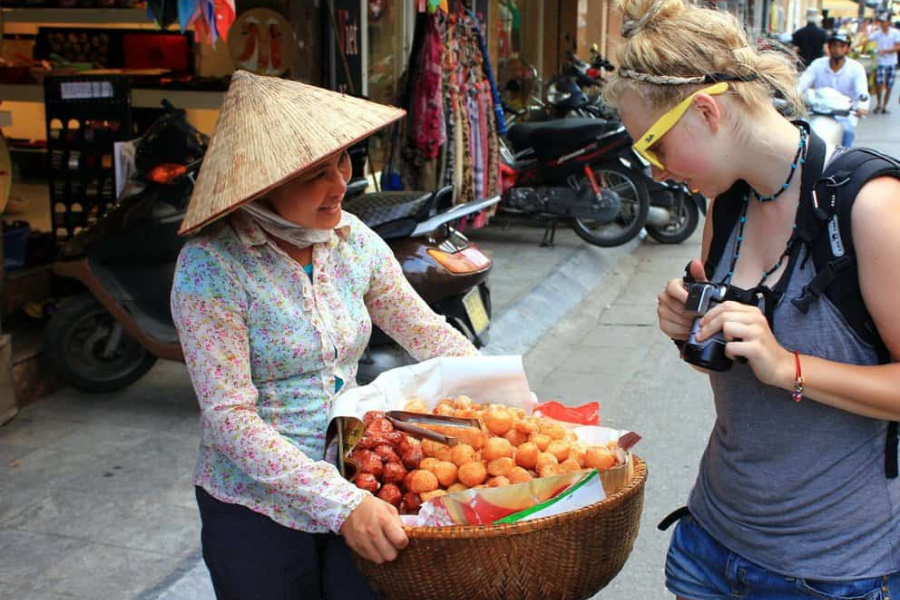 Engage in friendly bargaining at Ben Ngu Market